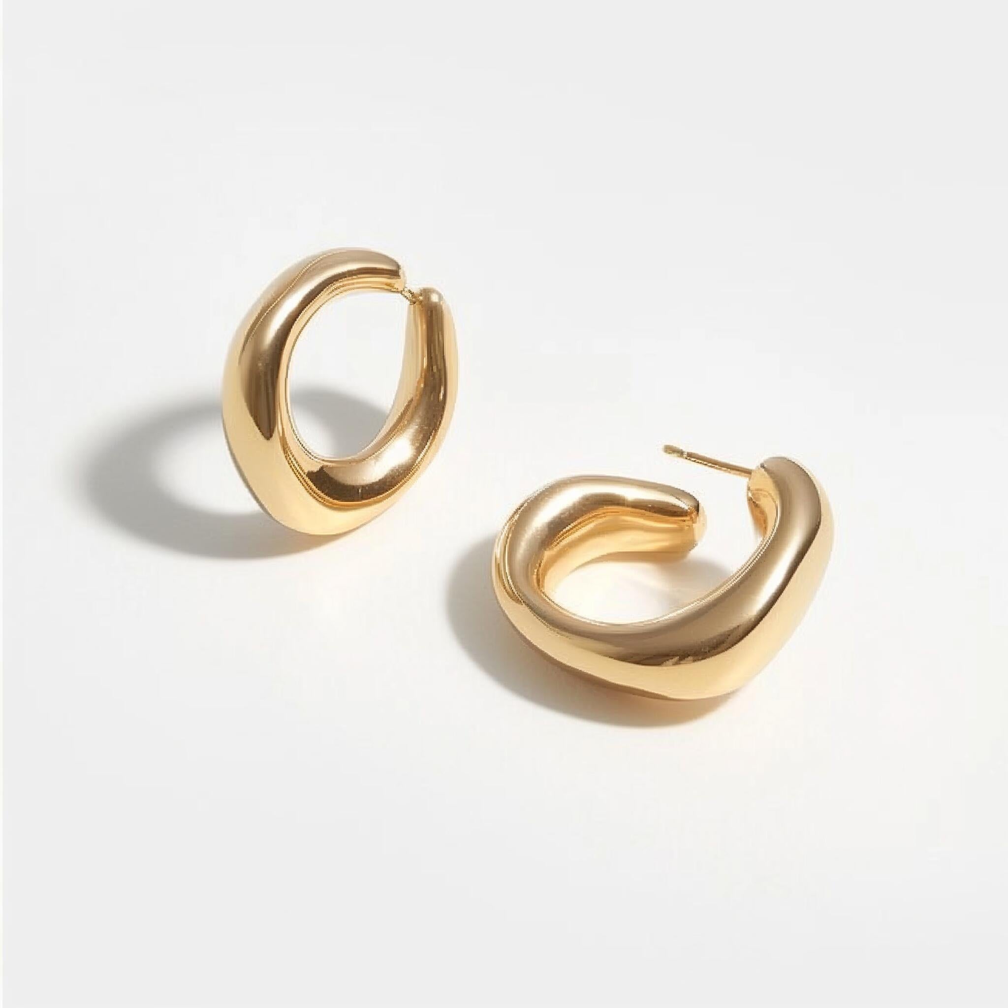 Elated gold earrings